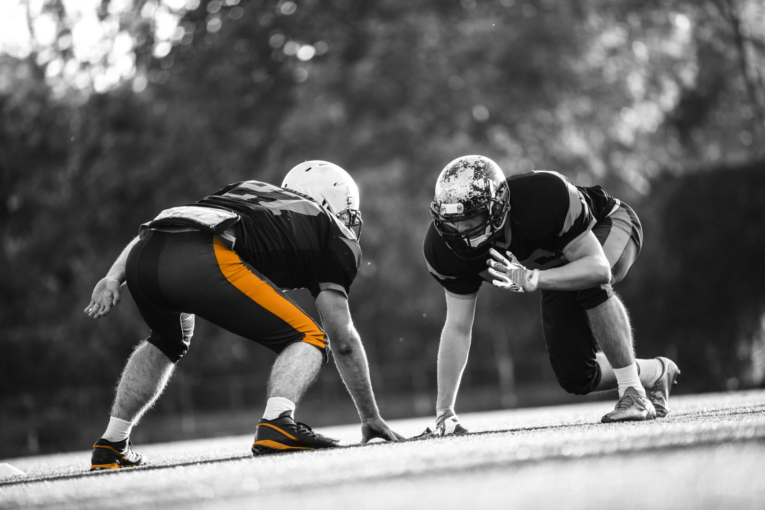 two football players black and white with orange