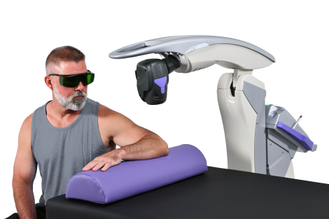 A man receiving MLS Laser Therapy on his elbow.