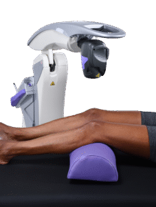 A woman received MLS Laser Therapy with the Robotic M7 Laser on her knee.